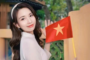 Runner-up Mivi Diem Anh Shines in Vibrant Ao Dai for Vietnam's Reunification Day - image 2