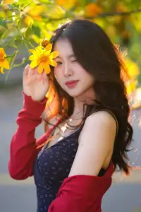 Elegant Asian Girl Portrait with Golden Flowers in Afternoon Sun 1000024552 - image 1