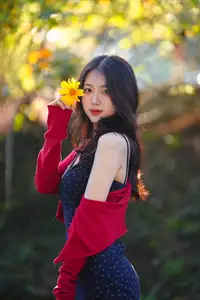Elegant Asian Girl Portrait with Golden Flowers in Afternoon Sun 1000024552 - image 2