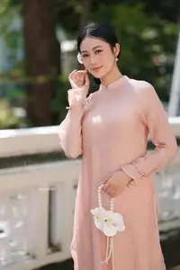 Timeless Beauty: Elegant Vietnamese Girl in Graceful Pink Ao Dai 1000024694 - image 9