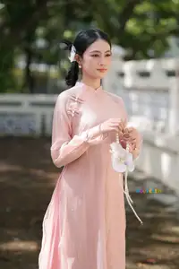 Timeless Beauty: Elegant Vietnamese Girl in Graceful Pink Ao Dai 1000024694 - image 7