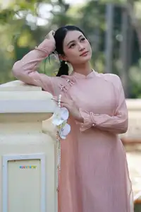 Timeless Beauty: Elegant Vietnamese Girl in Graceful Pink Ao Dai 1000024694 - image 11