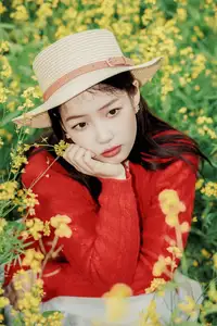 Gentle Beauty: A Girl in a Vibrant Rapeseed Flower Field, Spring Serenity - image 1