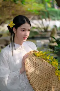 Vietnamese Beauty: Elegant Girl in White Ao Dai, Conical Hat with Yellow Flowers in Ancient Garden - image 2