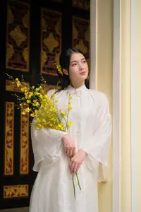 Vietnamese Beauty: Elegant Girl in White Ao Dai, Conical Hat with Yellow Flowers in Ancient Garden - image 3