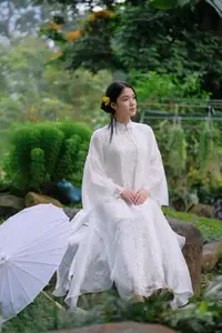 Vietnamese Beauty: Elegant Girl in White Ao Dai, Conical Hat with Yellow Flowers in Ancient Garden - image 5