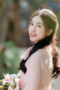 Poetic Beauty in Pink Ao Dai and White Lilies - image 1