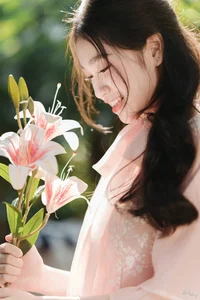 Poetic Beauty in Pink Ao Dai and White Lilies - image 5