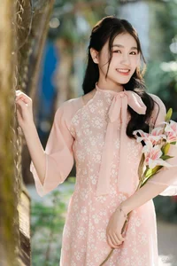 Poetic Beauty in Pink Ao Dai and White Lilies - image 4