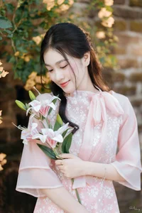 Poetic Beauty in Pink Ao Dai and White Lilies - image 8