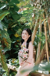 Poetic Beauty in Pink Ao Dai and White Lilies - image 2