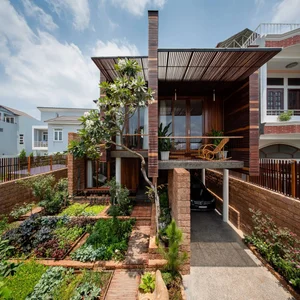 6 Inspiring Modern Townhouse Designs Featuring Lush Indoor Gardens, Natural Light, and Sustainable Biophilic Architecture for a Refreshing Urban Oasis - image 5