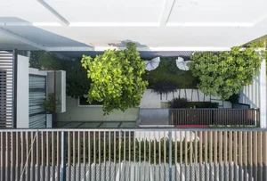 6 Inspiring Modern Townhouse Designs Featuring Lush Indoor Gardens, Natural Light, and Sustainable Biophilic Architecture for a Refreshing Urban Oasis - image 13