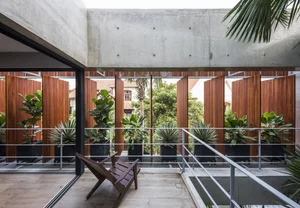 6 Inspiring Modern Townhouse Designs Featuring Lush Indoor Gardens, Natural Light, and Sustainable Biophilic Architecture for a Refreshing Urban Oasis - image 1