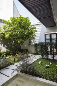 6 Inspiring Modern Townhouse Designs Featuring Lush Indoor Gardens, Natural Light, and Sustainable Biophilic Architecture for a Refreshing Urban Oasis - image 8