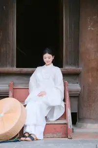 Pure Beauty: Girl in White with Orchids - Grace and Serenity of East Asian Charm - image 4