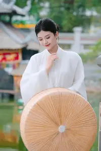 Pure Beauty: Girl in White with Orchids - Grace and Serenity of East Asian Charm - image 6