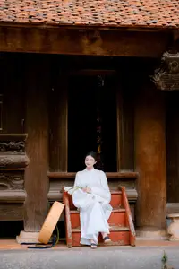 Pure Beauty: Girl in White with Orchids - Grace and Serenity of East Asian Charm - image 5