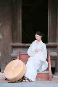 Pure Beauty: Girl in White with Orchids - Grace and Serenity of East Asian Charm - image 1