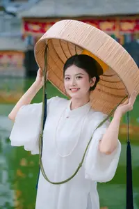 Pure Beauty: Girl in White with Orchids - Grace and Serenity of East Asian Charm - image 7
