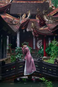 Graceful East Asian Beauty: Traditional Charm in a Lush Green Garden - image 5