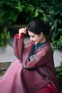 Graceful East Asian Beauty: Traditional Charm in a Lush Green Garden - image 13