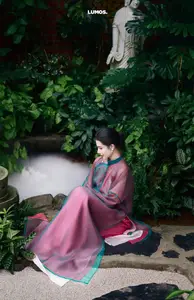 Graceful East Asian Beauty: Traditional Charm in a Lush Green Garden - image 9