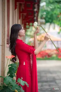 VGU No.188: Captivating Elegance: Vietnamese Beauty in Red Áo Dài with Sacred Lotus Flower. - image 1