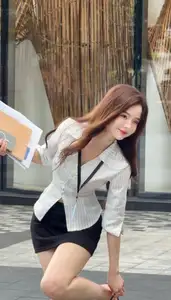 Vibrant Street Style: Young Woman Radiates Energy in Urban Chic Outfit - image 1