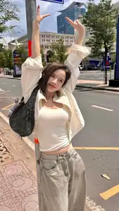 Vibrant Street Style: Young Woman Radiates Energy in Urban Chic Outfit - image 10
