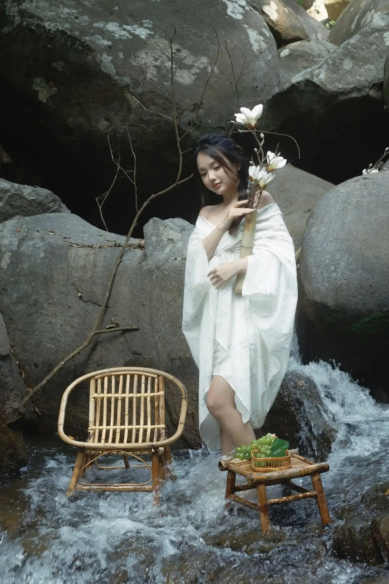 Serene Asian Beauty: A Delicate Moment with a White Flower