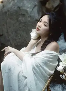 Serene Asian Beauty: A Delicate Moment with a White Flower - image 6