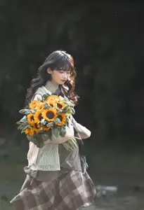 Youthful Beauty: A Gentle Girl Embracing Radiant Sunflowers - image 6
