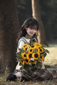 Youthful Beauty: A Gentle Girl Embracing Radiant Sunflowers - image 3