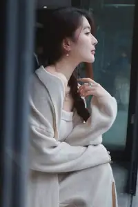 Discover the elegant charm of a gentle woman captured in a serene, thoughtful moment 176403855 - image 6