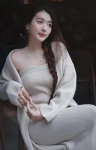 Discover the elegant charm of a gentle woman captured in a serene, thoughtful moment 176403855 - image 2