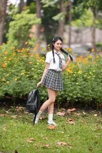 Gentle Schoolgirl's Innocent Beauty: Captivating School Style Amidst Vibrant Flowers - image 1