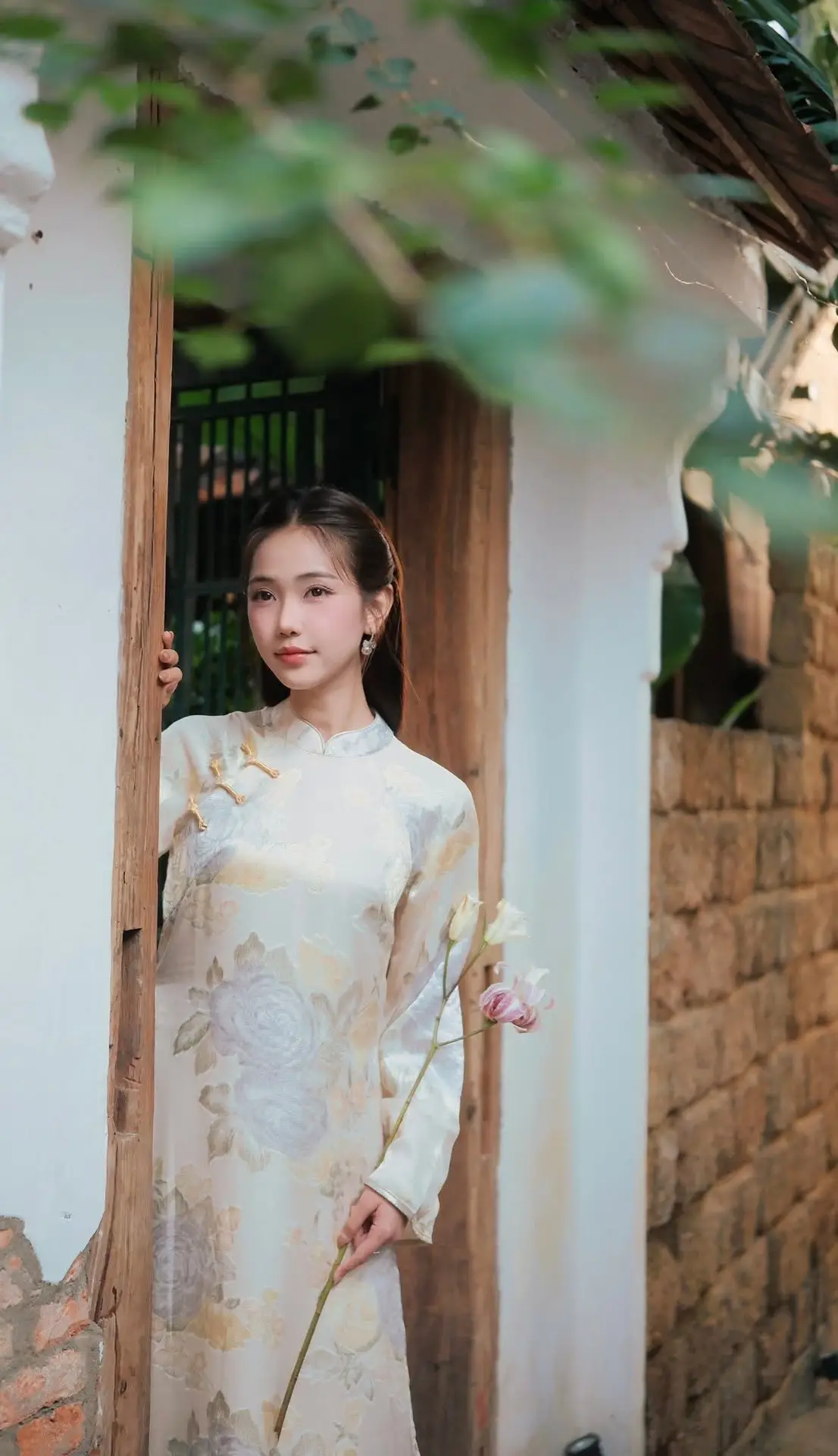 Captivating Asian Beauty: Elegant Woman Embracing Delicate Flowers