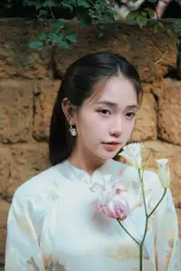 Captivating Asian Beauty: Elegant Woman Embracing Delicate Flowers - image 3