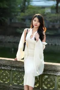 Elegant Beauty in Pristine White Dress Under Golden Afternoon Sun 1000027006 - image 0