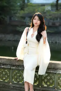 Elegant Beauty in Pristine White Dress Under Golden Afternoon Sun 1000027006 - image 1