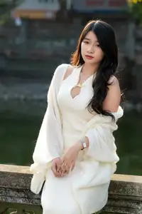 Elegant Beauty in Pristine White Dress Under Golden Afternoon Sun 1000027006 - image 6