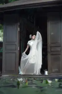 Timeless Grace: Vietnamese Woman in Modernized Ao Dai by a Serene Lotus Pond - image 12
