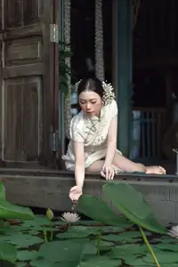Timeless Grace: Vietnamese Woman in Modernized Ao Dai by a Serene Lotus Pond - image 14