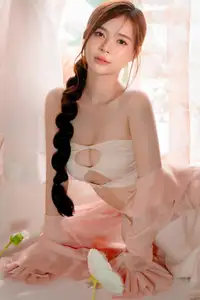 Ethereal Beauty: A Young Woman's Delicate Charm in a Flowing Pink Dress - image 20
