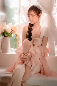Ethereal Beauty: A Young Woman's Delicate Charm in a Flowing Pink Dress - image 19