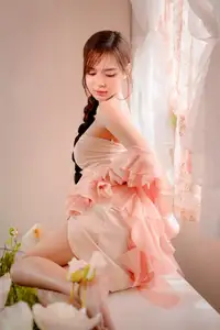Ethereal Beauty: A Young Woman's Delicate Charm in a Flowing Pink Dress - image 9