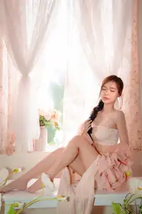 Ethereal Beauty: A Young Woman's Delicate Charm in a Flowing Pink Dress - image 14