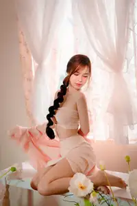 Ethereal Beauty: A Young Woman's Delicate Charm in a Flowing Pink Dress - image 11