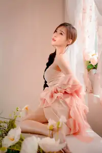 Ethereal Beauty: A Young Woman's Delicate Charm in a Flowing Pink Dress - image 7